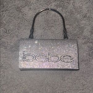 Bebe Silver Clutch with Rhinestone Logo
